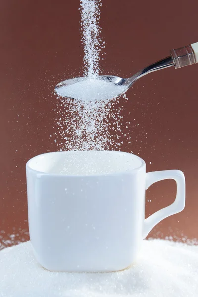 Ζάχαρη σε καφέ φόντο — Φωτογραφία Αρχείου
