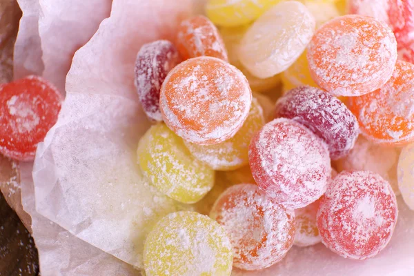 Sweet multicolor candies on paper, close up — Stock Photo, Image