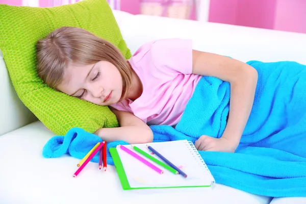 Little girl sleeping on sofa in room — Stock Photo, Image