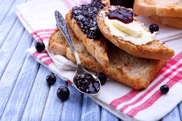 Delicious toast with jam on table close-up — Stock Photo, Image