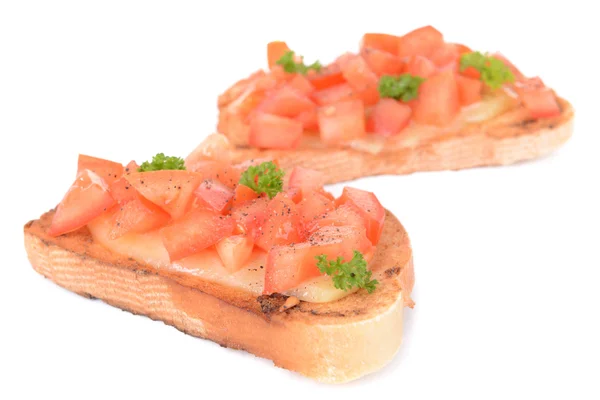 Lezzetli, üzerinde beyaz izole domates bruschetta — Stok fotoğraf