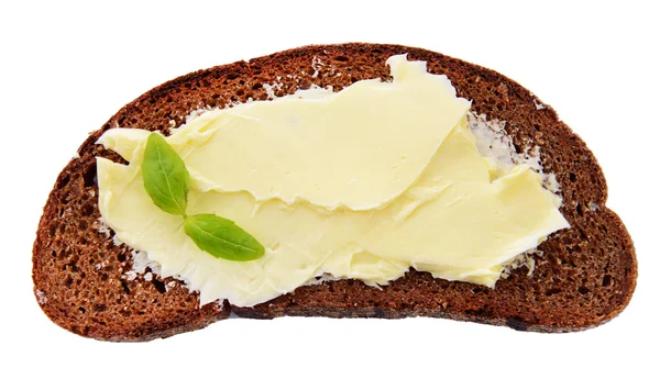 Rebanada de pan de centeno con mantequilla, aislado en blanco —  Fotos de Stock