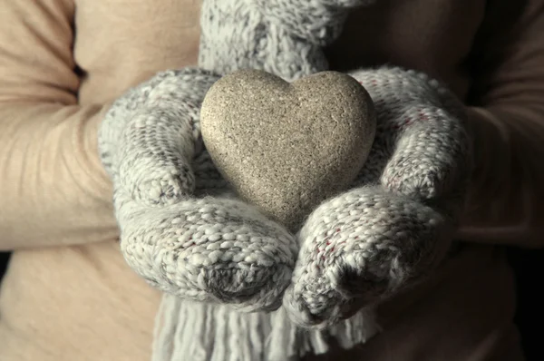 Female hands in mittens with heart, close-up — Stock Photo, Image