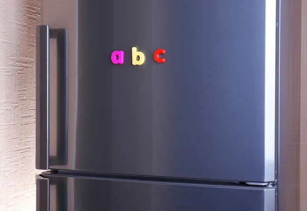 Colorful magnetic letters on refrigerator — Stock Photo, Image