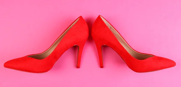 Beautiful red female shoes, on pink background — Stock Photo, Image