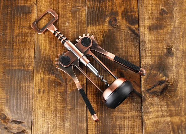 Corkscrew on wooden background — Stock Photo, Image