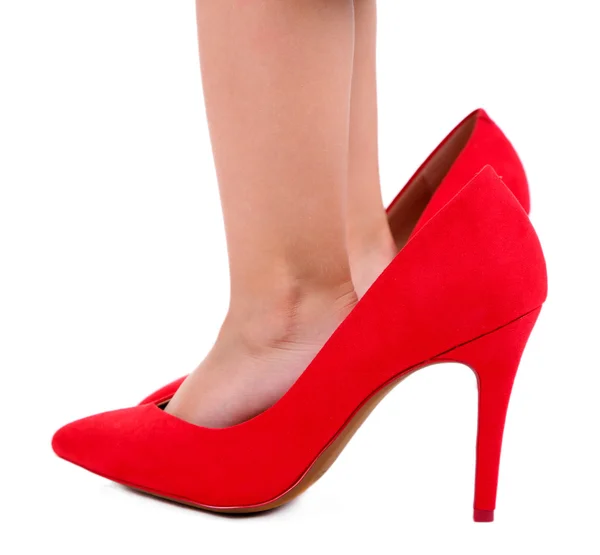 Liten flicka i röda skor isolerad på vit — Stockfoto