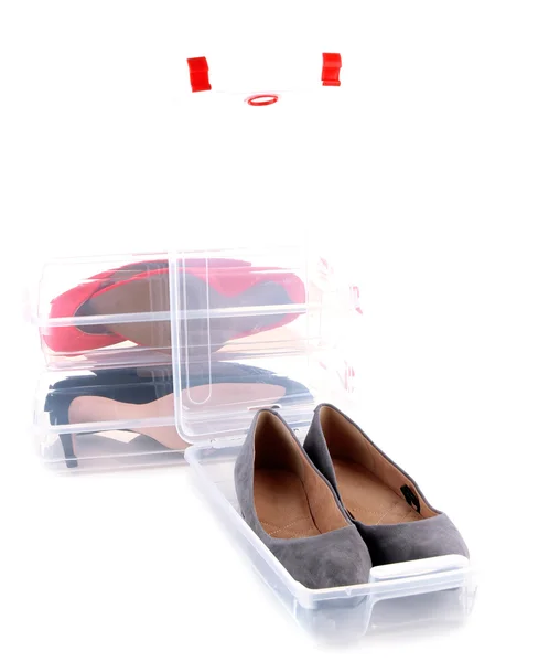 Beautiful female shoes in plastic boxes, isolated on white — Stock Photo, Image