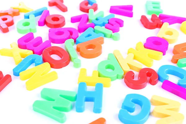 Colorful magnetic letters isolated on white — Stock Photo, Image