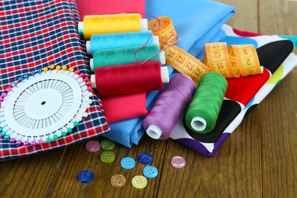 Sewing accessories on wooden table — Stock Photo, Image
