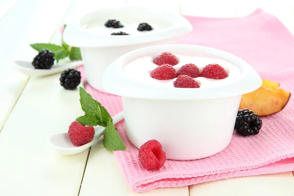 Delicious yogurt with fruit and berries on table close-up Stock Image