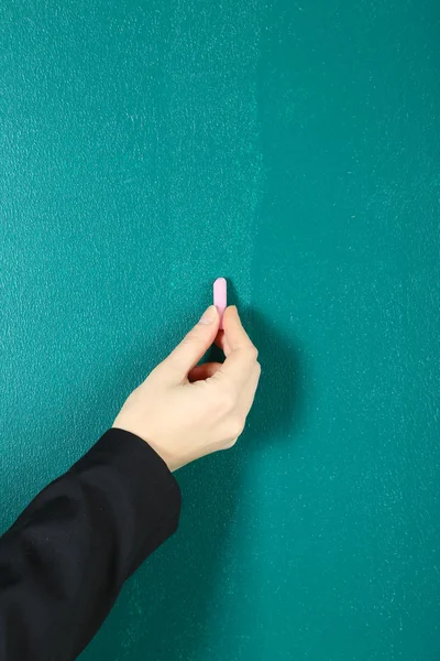 Hand writing on blackboard in class room — Stock Photo, Image