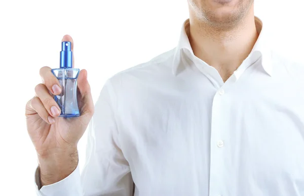 Stilig ung man använder parfym isolerad på vit — Stockfoto