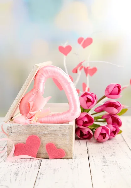 Romantic still life with heart in wooden casket — Stock Photo, Image