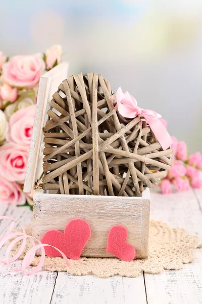 Romantic still life with heart in wooden casket — Stock Photo, Image