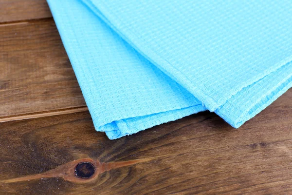 Kitchen towels on wooden background — Stock Photo, Image