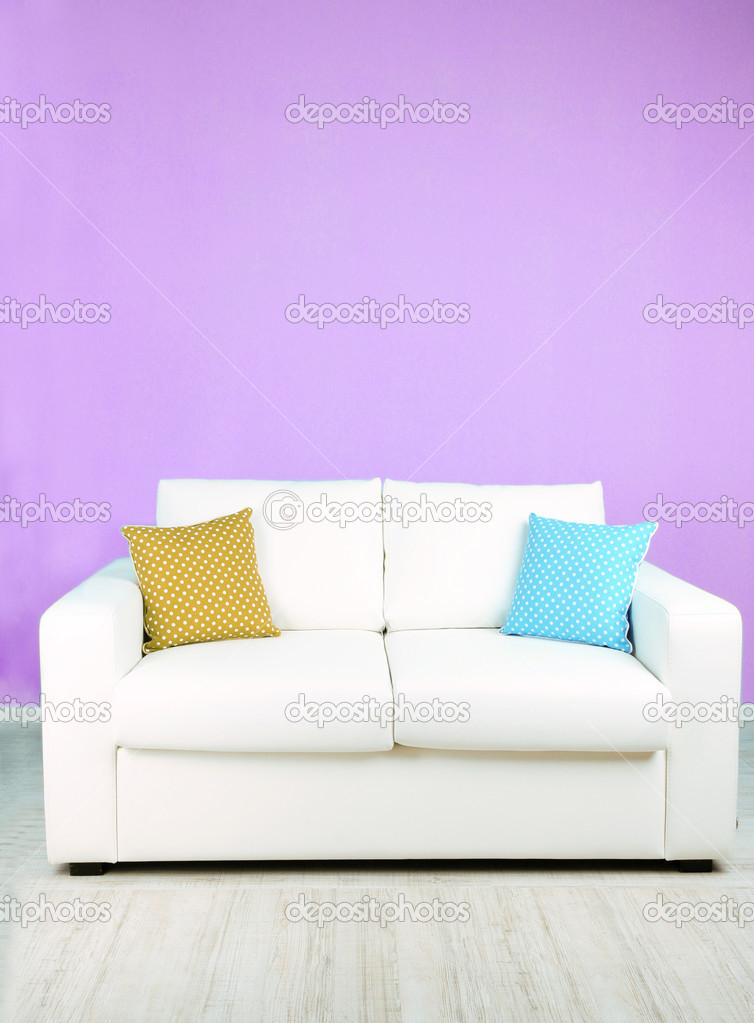 White sofa in room on lilac background