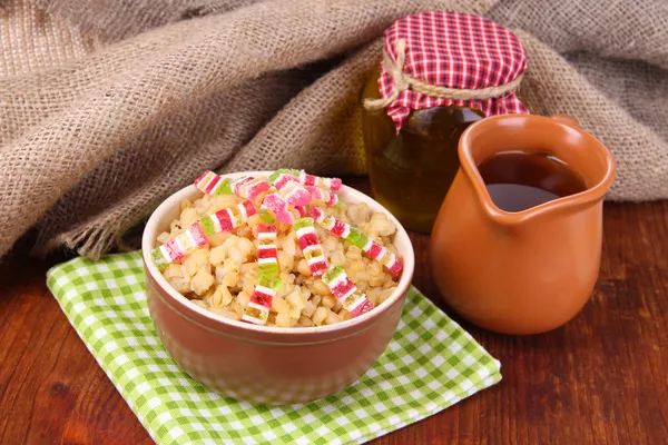 Bowl with kutia - traditional Christmas sweet meal in Ukraine, Belarus and Poland, on wooden background — Stock Photo, Image