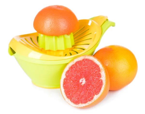 Citrus press and grapefruits isolated on white — Stock Photo, Image