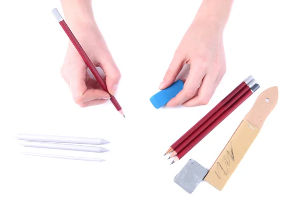 Mani con matite e cancellare isolato su bianco — Foto Stock