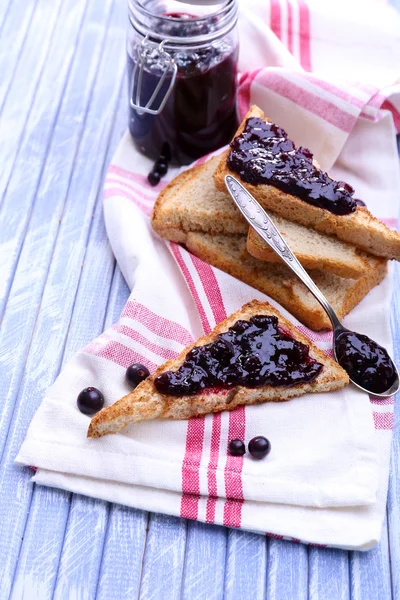 Delicious toast with jam on table close-up — Stock Photo, Image