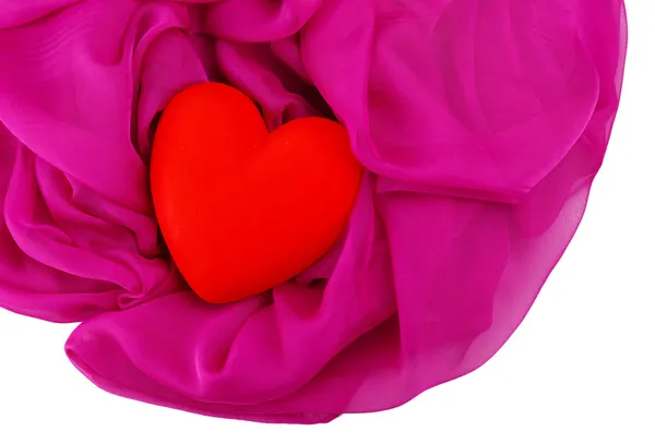 Coeur rouge décoratif, sur tissu couleur, isolé sur blanc — Photo