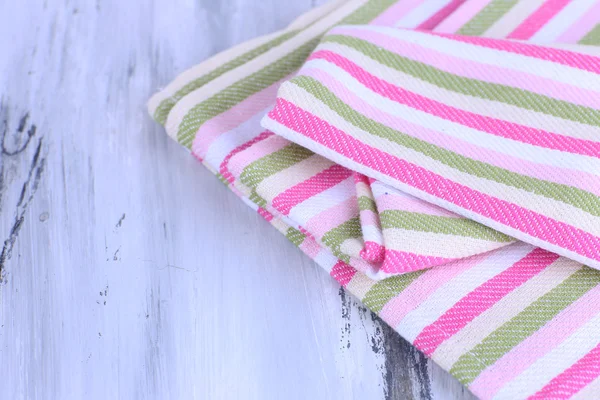 Kitchen towels on wooden background — Stock Photo, Image