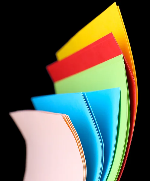 Colorful art paper on black background — Stock Photo, Image