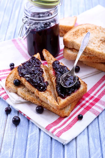 Delicious toast with jam on table close-up — Stock Photo, Image