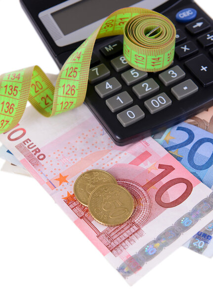 Tape measure with money and calculator close-up