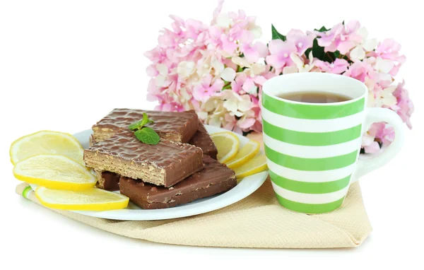 Cup of tea and sweets isolated on white — Stock Photo, Image