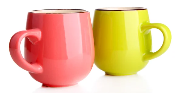 Roze en groene cups geïsoleerd op wit — Zdjęcie stockowe