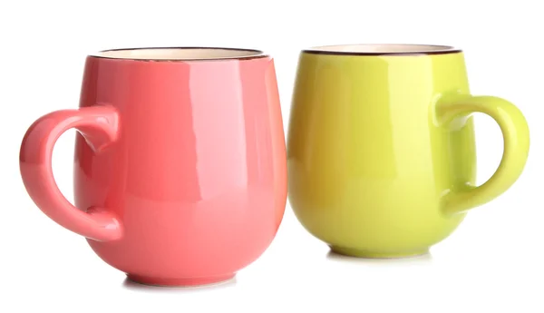 Roze en groene cups geïsoleerd op wit — Zdjęcie stockowe