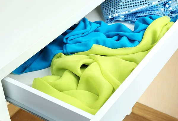 Open drawer with fabrics close up — Stock Photo, Image