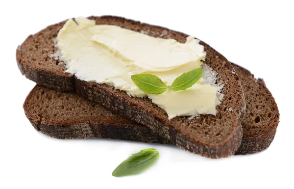 Plátky žitného chleba s máslem, izolované na bílém — Stock fotografie