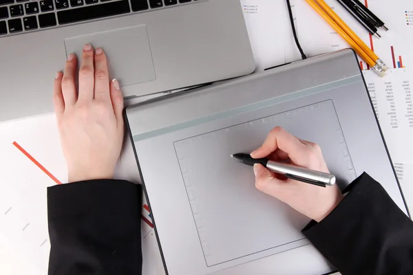 Female hand using graphics tablet on table close up — Stock Photo, Image