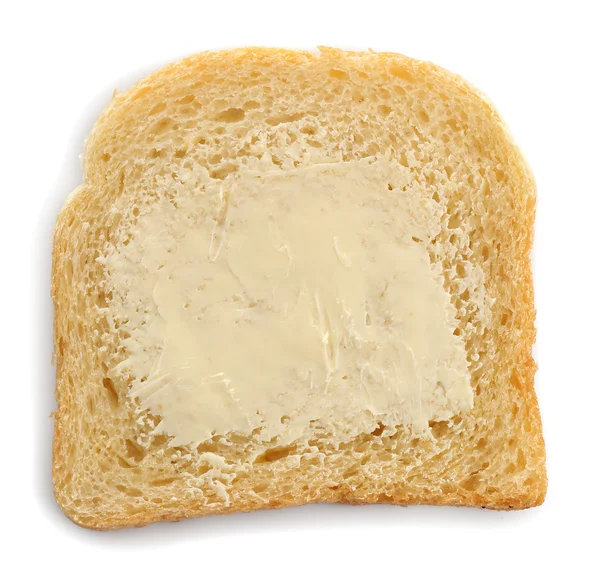Krajíc chleba s máslem, izolované na bílém — Stock fotografie