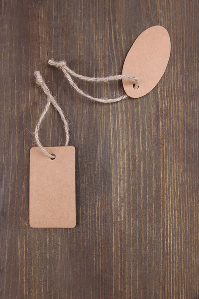Set of tags on color wooden background — Stock Photo, Image