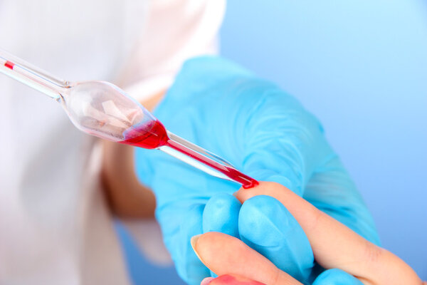 Nurse taking a blood sample, close up