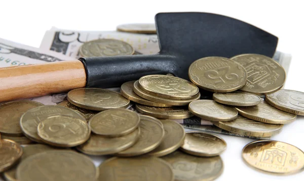 Geld met schop close-up — Stockfoto