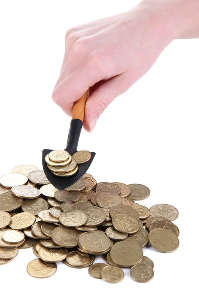 Hand som håller spade med mynt isolerad på vit — Stockfoto