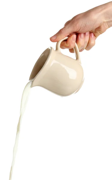 Verter la leche de la jarra, aislado en blanco — Foto de Stock