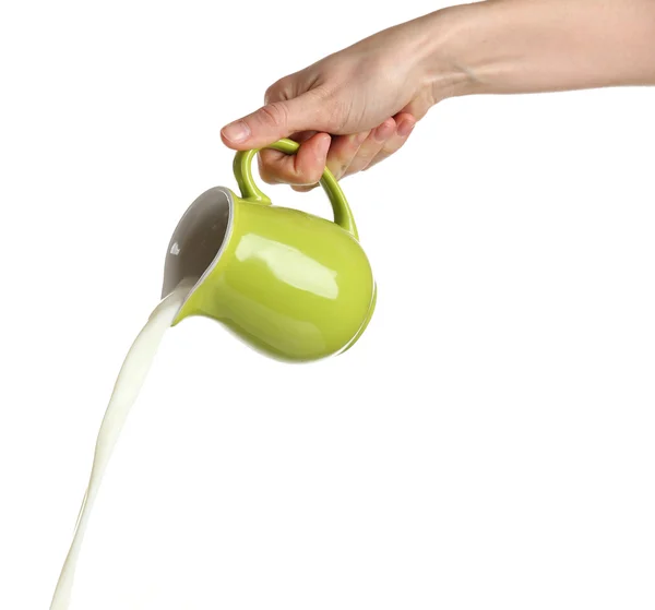 Pouring milk from pitcher, isolated on white — Stock Photo, Image
