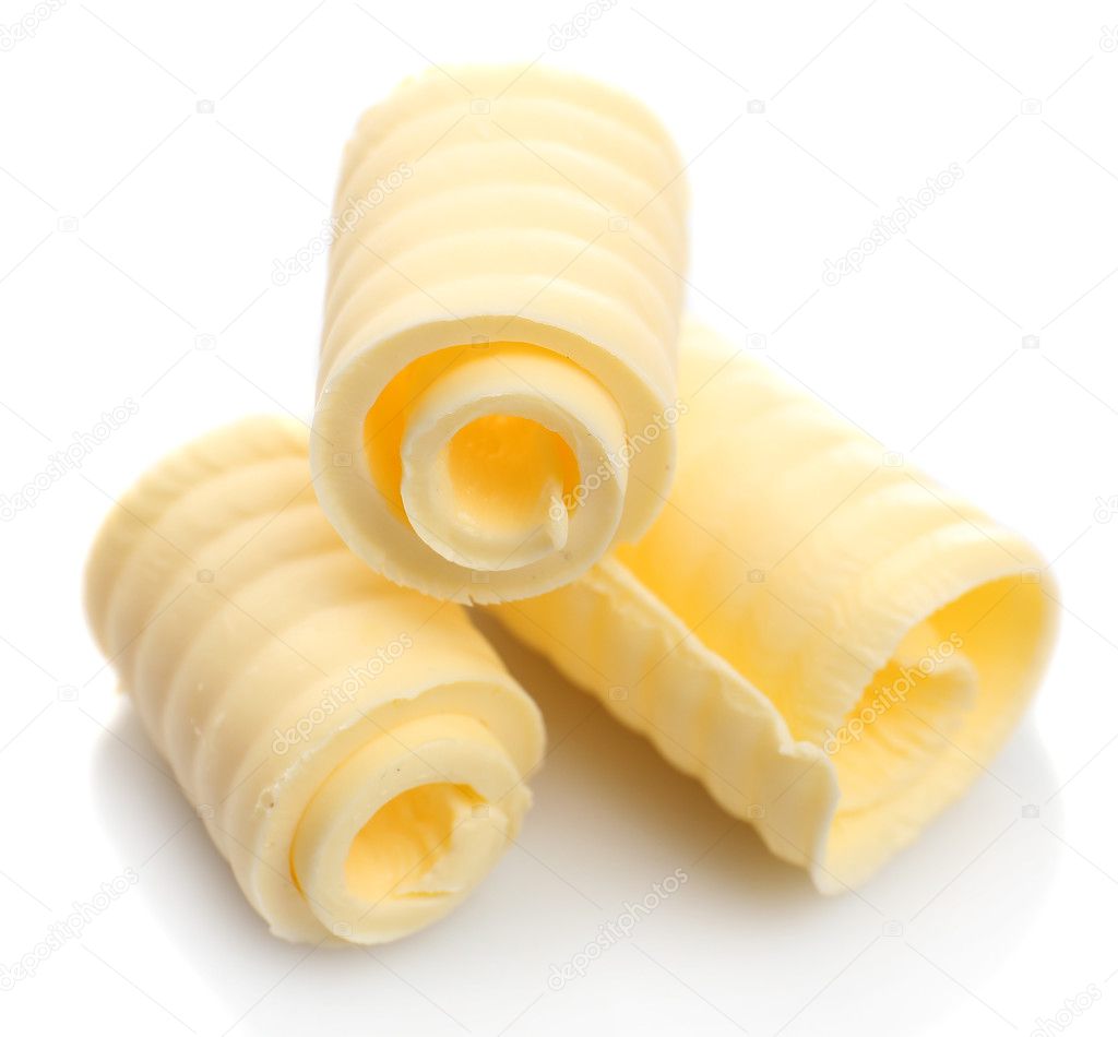 Curls of fresh butter, isolated on white