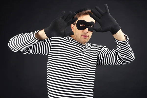 Thief isolated on black — Stock Photo, Image