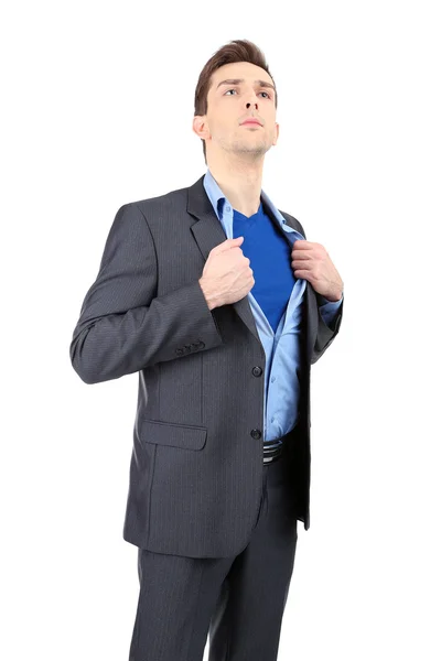 Young business man tearing apart his shirt revealing superhero suit, isolated on white — Stock Photo, Image