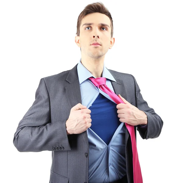 Joven hombre de negocios desgarrando su camisa revelando traje de superhéroe, aislado en blanco — Foto de Stock