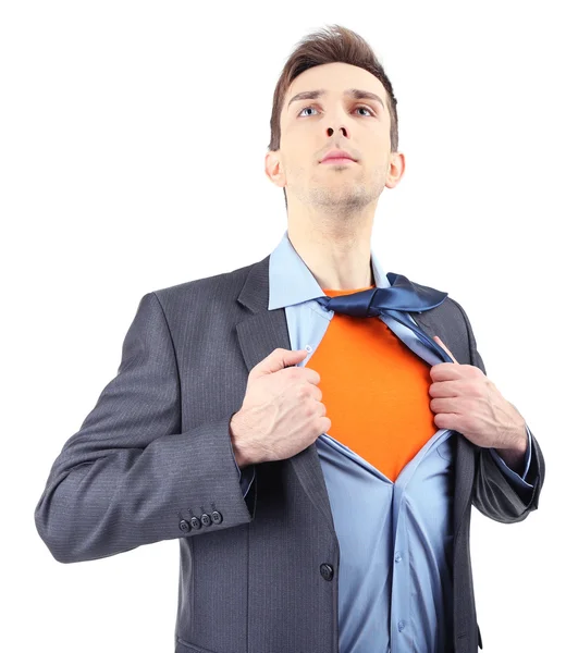 Young business man tearing apart his shirt revealing superhero suit, isolated on white — Stock Photo, Image