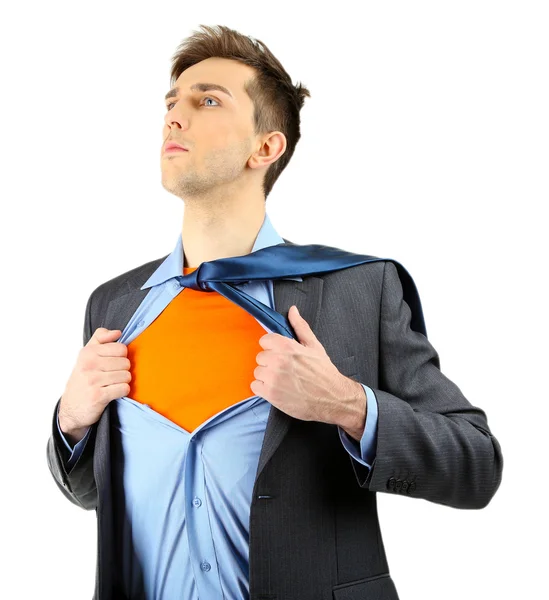 Young business man tearing apart his shirt revealing superhero suit, isolated on white — Stock Photo, Image