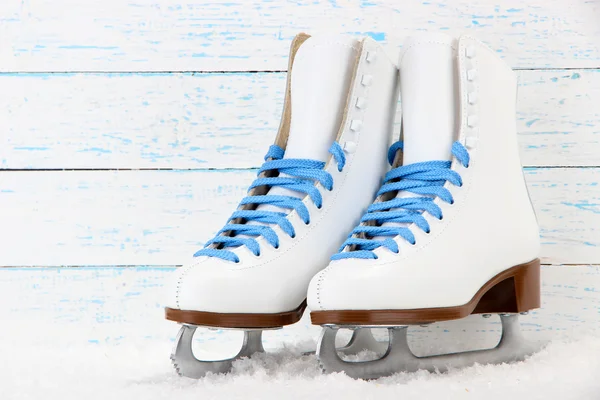 Figure skates on wooden background — Stock Photo, Image